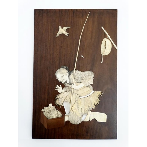 843 - A 19thC Japanese hardwood plaque with ivory and mother of pearl inlay depicting a figure freeing a m... 