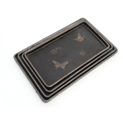 846 - Dong Snao An Wares - Foochow, China : A set of 4 graduated lacquered trays. largest 8 1/2'' x 14''