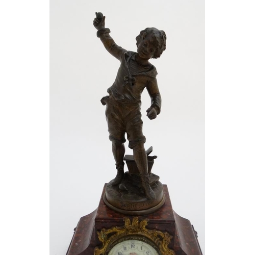 86 - French Clock : a red marble cased mantle clock  with ormolou mounts surmounted by a spelter figure e... 