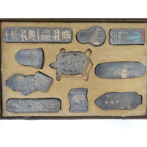 863 - Chinese : An early 20thC cased set of 10 ink blocks  , double sided, some with polychrome decoration... 