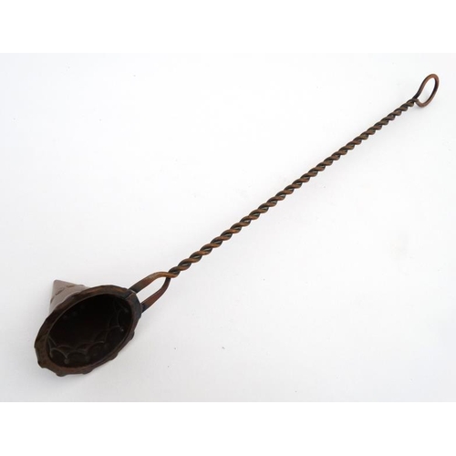 879 - A 19thC Arts and Crafts copper candle snuffer 12 1/2'' long