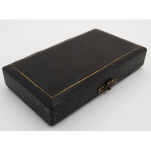 880 - A c.1900 necessaire box opening to reveal a quantity of sewing tools. 5 3/8'' long x 3 1/8'' deep