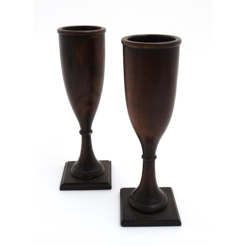 881 - A pair of walnut turned flutes on squared bases 7 7/8'' high