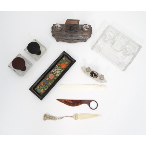 894 - A quantity of c.1900 desk items to include a glass standish, 2 glass inkwells with red and black lid... 