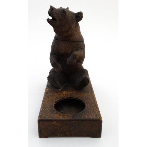 902 - A 1928 Black Forest musical tobacco stand with carved bear decoration. Bears label under 'Just you R... 