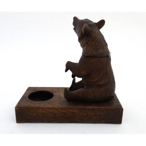 902 - A 1928 Black Forest musical tobacco stand with carved bear decoration. Bears label under 'Just you R... 