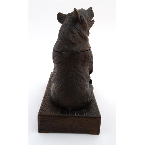 902 - A 1928 Black Forest musical tobacco stand with carved bear decoration. Bears label under 'Just you R... 