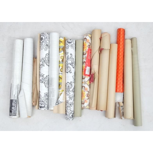 91 - Vintage Retro :  a box containing 14 Original  rolls of wall paper, each with designs of the period.