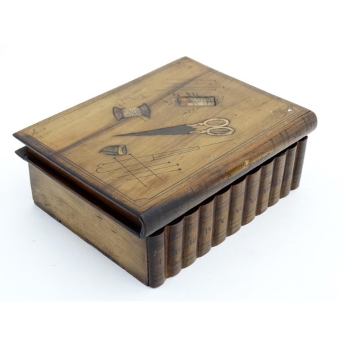 923 - A Continental olive wood puzzle sewing box in the form of stacked books with sections within. 8'' wi... 