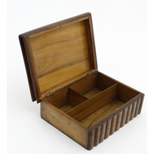 923 - A Continental olive wood puzzle sewing box in the form of stacked books with sections within. 8'' wi... 