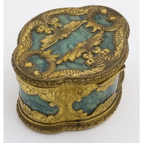 936 - A 19thC malachite and gilt brass quatrefoil shaped jewellery box with 4 lift out trays revealing a v... 