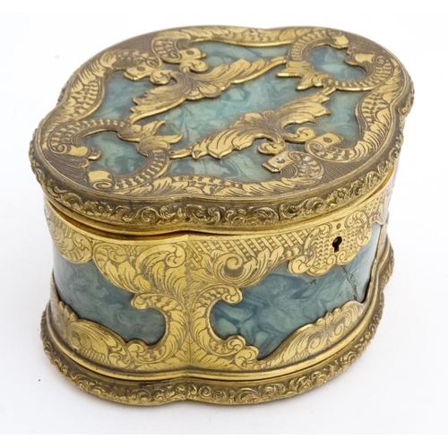 936 - A 19thC malachite and gilt brass quatrefoil shaped jewellery box with 4 lift out trays revealing a v... 