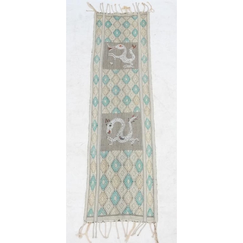 937 - A cotton table runner with pale yellow and green diamond design on a cream ground, having two panels... 