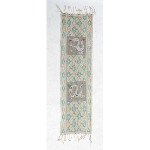 937 - A cotton table runner with pale yellow and green diamond design on a cream ground, having two panels... 