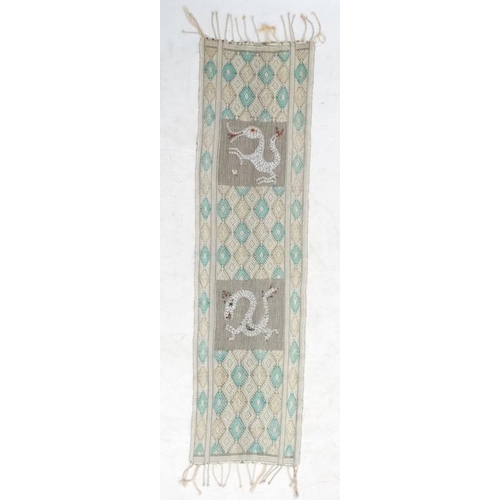 937 - A cotton table runner with pale yellow and green diamond design on a cream ground, having two panels... 