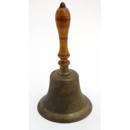 939 - A large handbell with turned fruit wood handle, the whole standing 14 1/2'' high