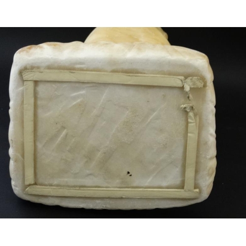 942 - A c.1900 white marble figure of a boy preying on one knee resting upon a squared cushion 14 1/2'' hi... 