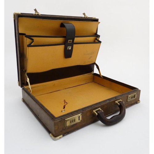 955 - Leather attaché case with combination lock marked Ferrari. 17 1/4'' x 3 1/2'' x 12 3/4''