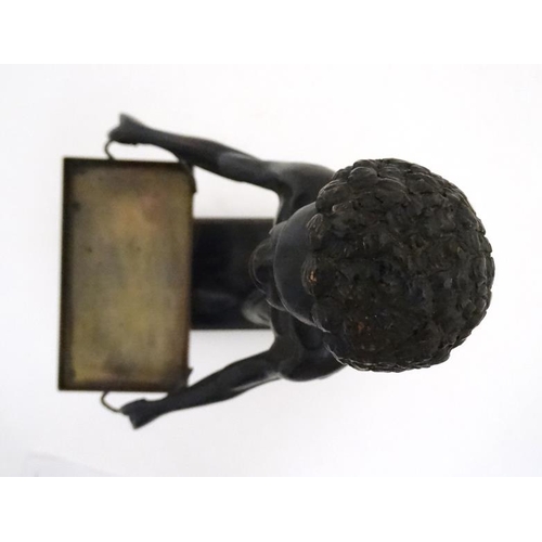 958 - Tobacco shop figure : An early 20thC model of a negro figure on base holding a tray selling cigars e... 