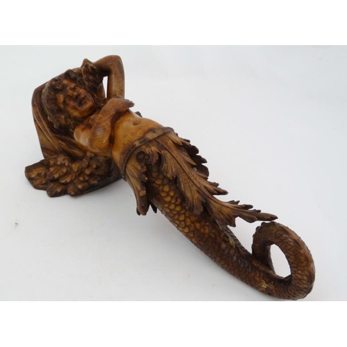 963 - A 19thC carved pine figurehead / caryatid wall bracket in the form of a winged mermaid with acanthus... 