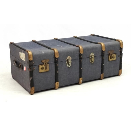 969 - Travelling Trunk : A Eugeno denim like banded travel trunk with lift out tray. Bears South African r... 