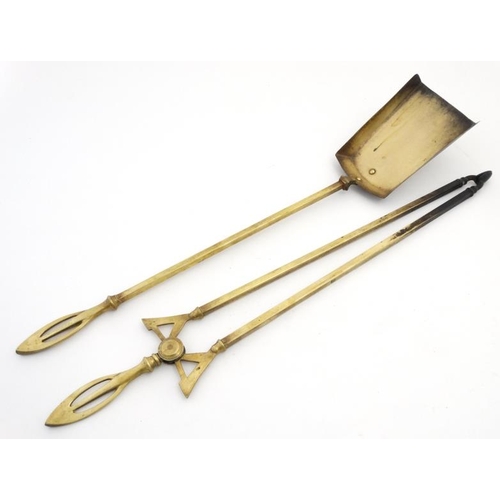 971 - Two early 20thC brass fire tools comprising tong and shovel with ornate handle. each approx 26'' lon... 