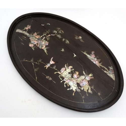 972 - A Chinese native hardwood oval tray depicting abalone and mother of pearl inlay together with a smal... 