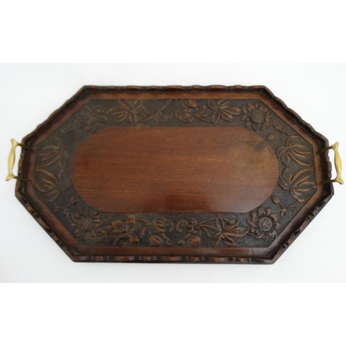 981A - A late 19thC carved mahogany tray with brass handles 24 1/2'' long x 14 1/4'' wide