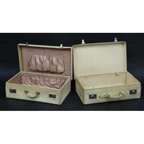 990 - A pair of matching velum suitcases, one brown silk lined, the other canvas lined. each initialled AE... 