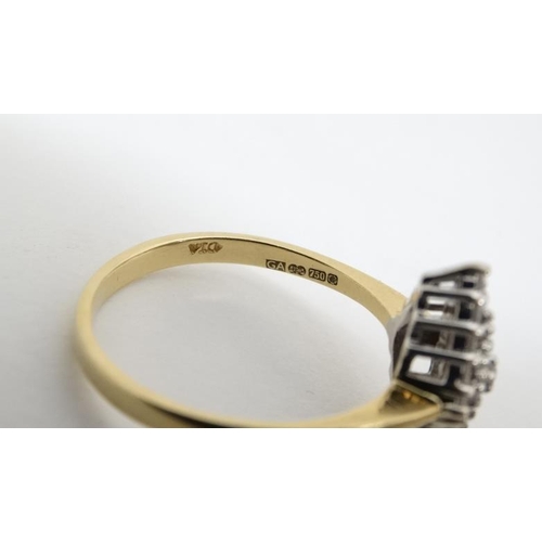 999 - An 18ct gold ring set with approx 25 diamonds