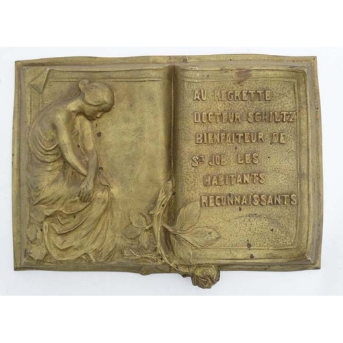 988 - A 19thC gilt painted plaque in the form of an open book in relief stating 'Au Regrette Docteur Schil... 