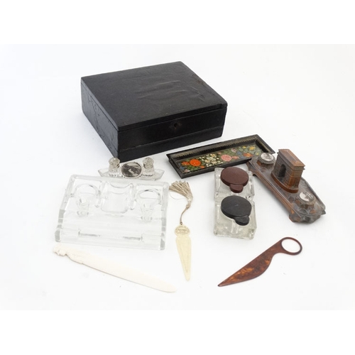 894 - A quantity of c.1900 desk items to include a glass standish, 2 glass inkwells with red and black lid... 