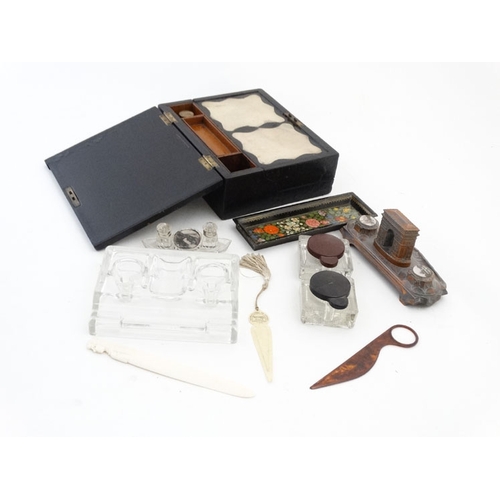 894 - A quantity of c.1900 desk items to include a glass standish, 2 glass inkwells with red and black lid... 