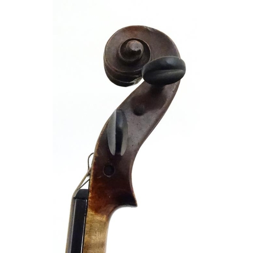 389 - Musical Instruments : An early 20thC Violin , bears oval label within for ' Murdoch , Murdoch & Co L... 