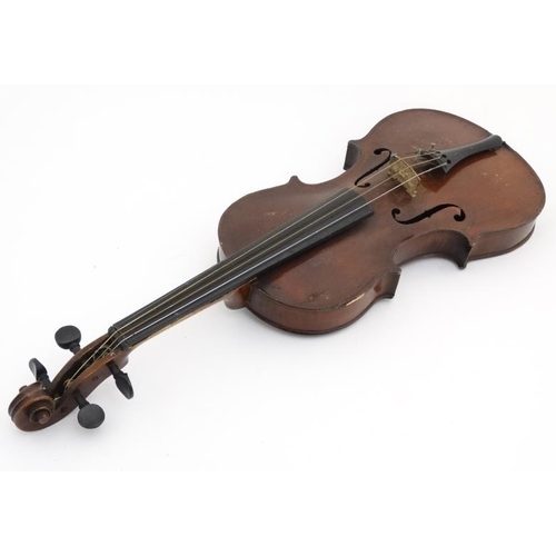 389 - Musical Instruments : An early 20thC Violin , bears oval label within for ' Murdoch , Murdoch & Co L... 