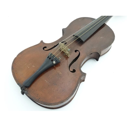 389 - Musical Instruments : An early 20thC Violin , bears oval label within for ' Murdoch , Murdoch & Co L... 