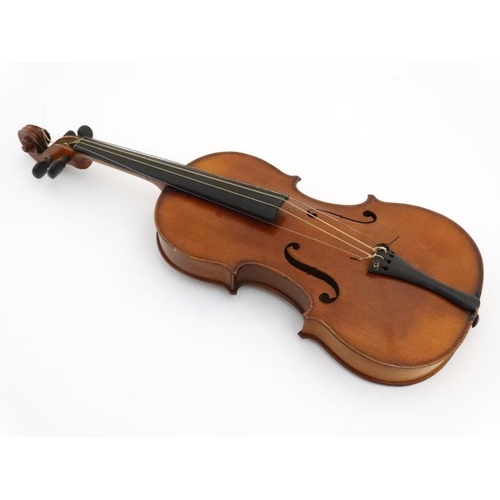 392 - Musical Instruments : An early 20thC 3/4 size student's Violin . Bears label within ' Phebe ' ( thou... 