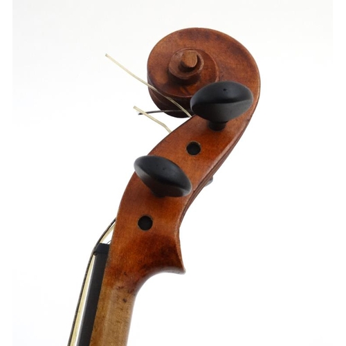 392 - Musical Instruments : An early 20thC 3/4 size student's Violin . Bears label within ' Phebe ' ( thou... 