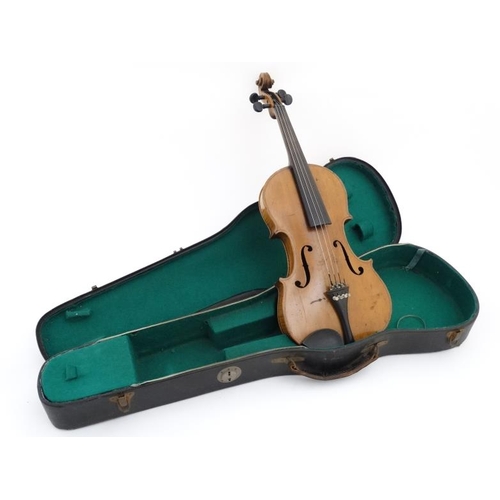 394 - Musical Instruments : An early to mid 20thC Violin , bears label within for ' Copy of Antonius Strad... 