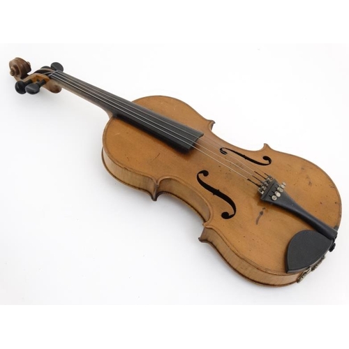 394 - Musical Instruments : An early to mid 20thC Violin , bears label within for ' Copy of Antonius Strad... 