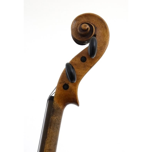 394 - Musical Instruments : An early to mid 20thC Violin , bears label within for ' Copy of Antonius Strad... 