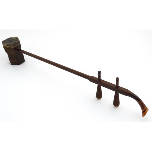 396 - Musical Instruments : An early to mid 20thC Chinese Erhu , ' Chinese Violin ' , the body and neck of... 