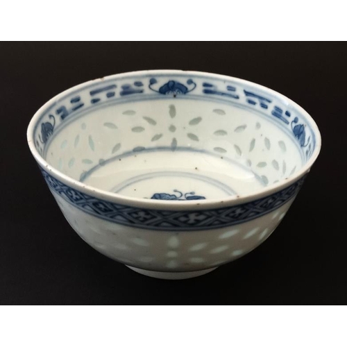 400 - A Chinese blue and white rice bowl, having translucent rice decoration to side and luck symbol to ce... 