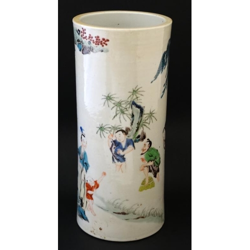 402 - A Chinese famille rose cylinder vase decorated in polychrome with figures fishing in a stream set in... 