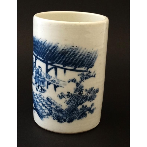 403 - A Chinese blue and white brush pot, decorated with potters at work in a garden scene , bears blue Ch... 