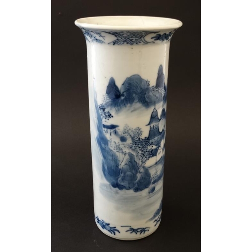 407 - A small Chinese blue and white flared rim cylinder vase, the sides decorated with buildings beside a... 