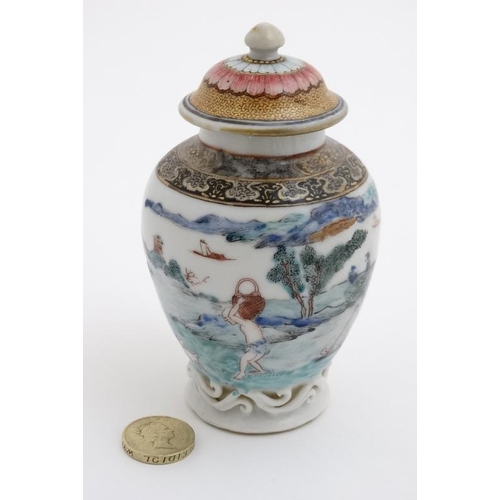 414 - A small Chinese famille rose baluster lidded vase , decorated with figures and goats, farming by a v... 