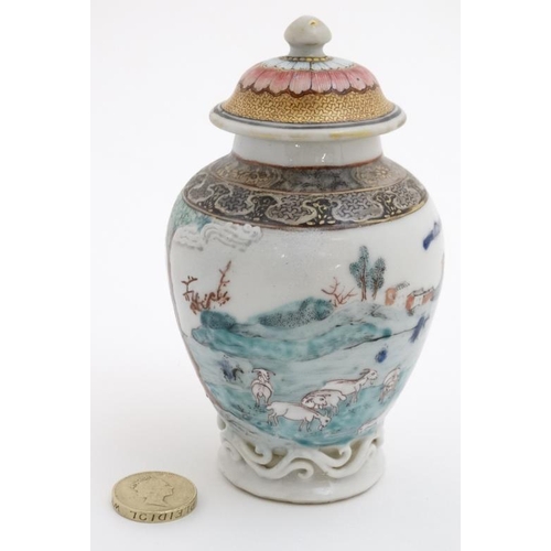 414 - A small Chinese famille rose baluster lidded vase , decorated with figures and goats, farming by a v... 