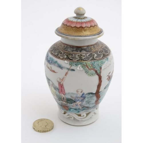 414 - A small Chinese famille rose baluster lidded vase , decorated with figures and goats, farming by a v... 