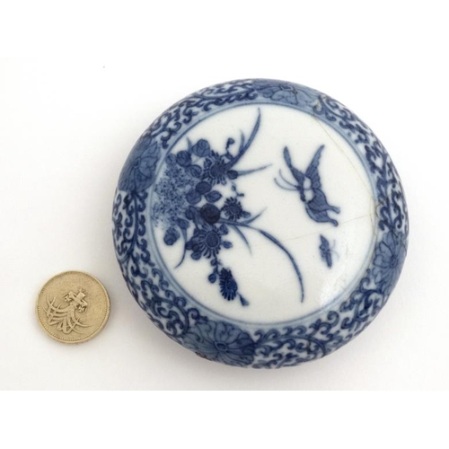 416 - A Chinese blue and white inkbox the central cartouche decorated with butterflies and flora, the bord... 